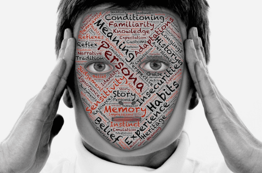 A person with their face covered by words.