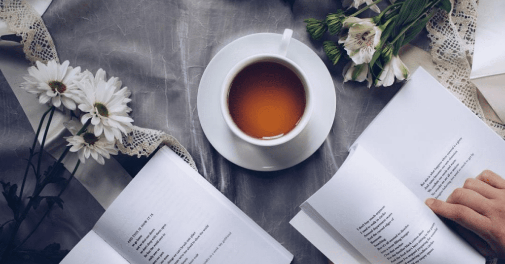 A cup of tea and some books on the table